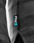 Close-up of a black textured fabric with a 'FiberQ' label.