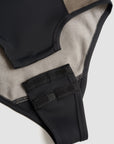 crotch closure of a Black and grey moto bodysuit