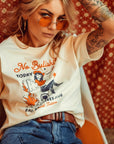 a woman wearing off white/creame colour t-shirt with retro motive that says No bullshit