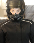 A women with a black helmet and wearing black textile motorcycle jacket from MotoGirl