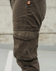 A close up of the pocket on olive green women's motorcycle pants from Motogirl