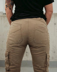 A woman's bottom wearing beige women's motorcycle cargo pants from mOTO gIRL
