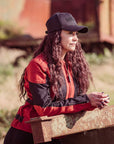 a woman with the cap wearing red and black women's motorcycle summer jacket from Moto Girl
