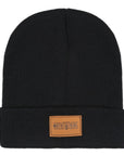 Black beanie from MotoGirl with a brown faux leather tag on the front featuring the MotoGirl logo.