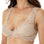 Dark-haired woman wearing nude-colored wide shoulder lace bralette from Tramonte.