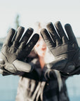 Woman holding up her hands with the Inner side of black Nandi MotoGirl winter motorcycle gloves with paw touch detail on the index and middle fingers and two adjustable velcro fastenings for an optimal fit.