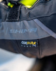 A close up of the Cordura fabric label on the shima motorcycle touring jacket for women in black/ fluo