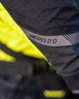 A close up of the HERO 2.0 reflective panel on the shima motorcycle touring jacket for women in black/ fluo