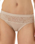 woman wearing nude-colored high-hip briefs with lace details in the top from Tramonte.