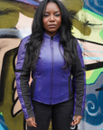 a black woman wearing purple motorcycle leather jacket for women with front zipper 