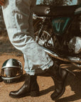 Woman wearing women's black leather motorcycle shoes 