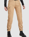 woman's lower body wearing beige mc cargo pants for ladies from pando moto 