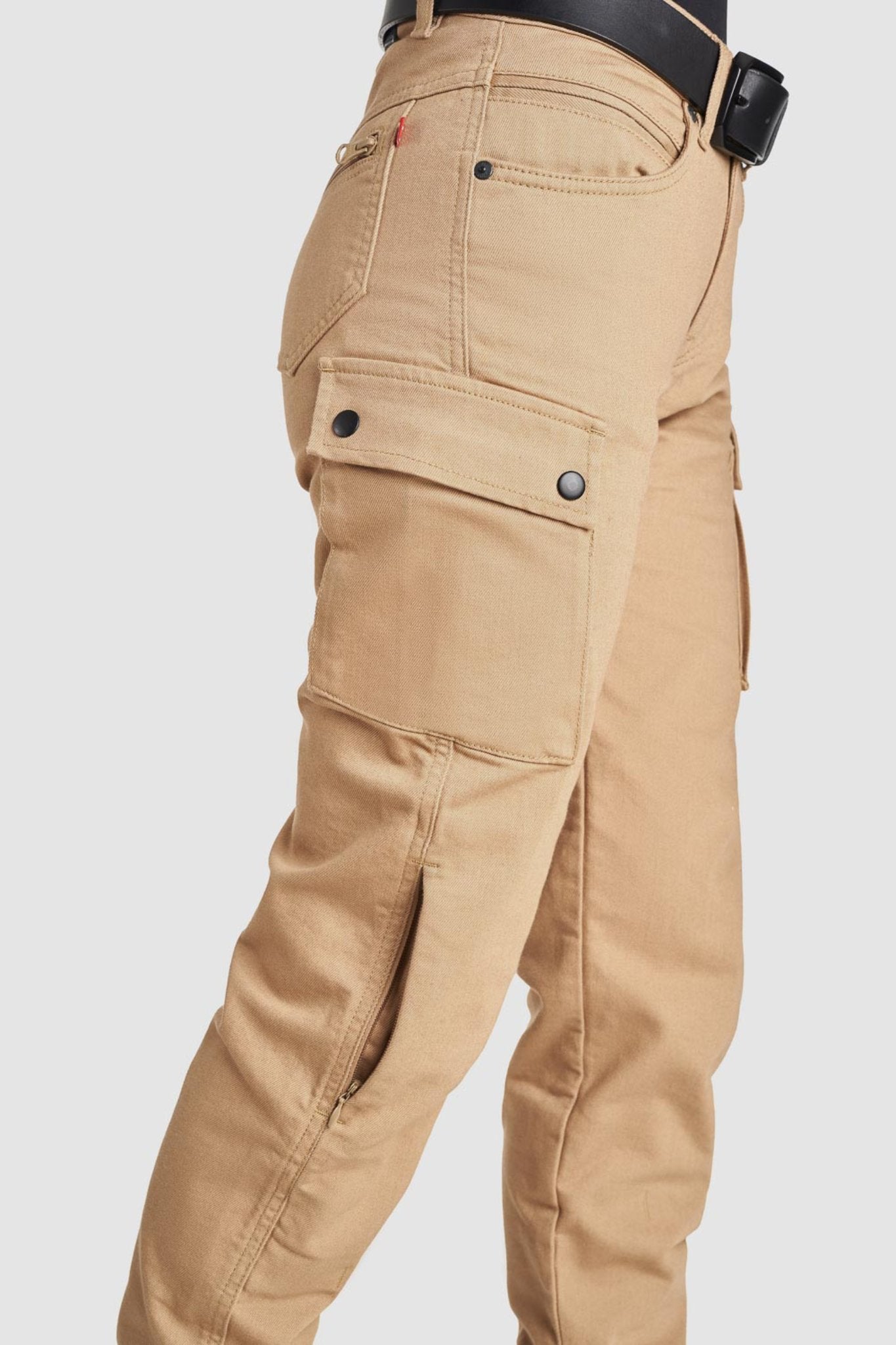 A close-up of the cargo pocket on the beige women's MC pants from the side.