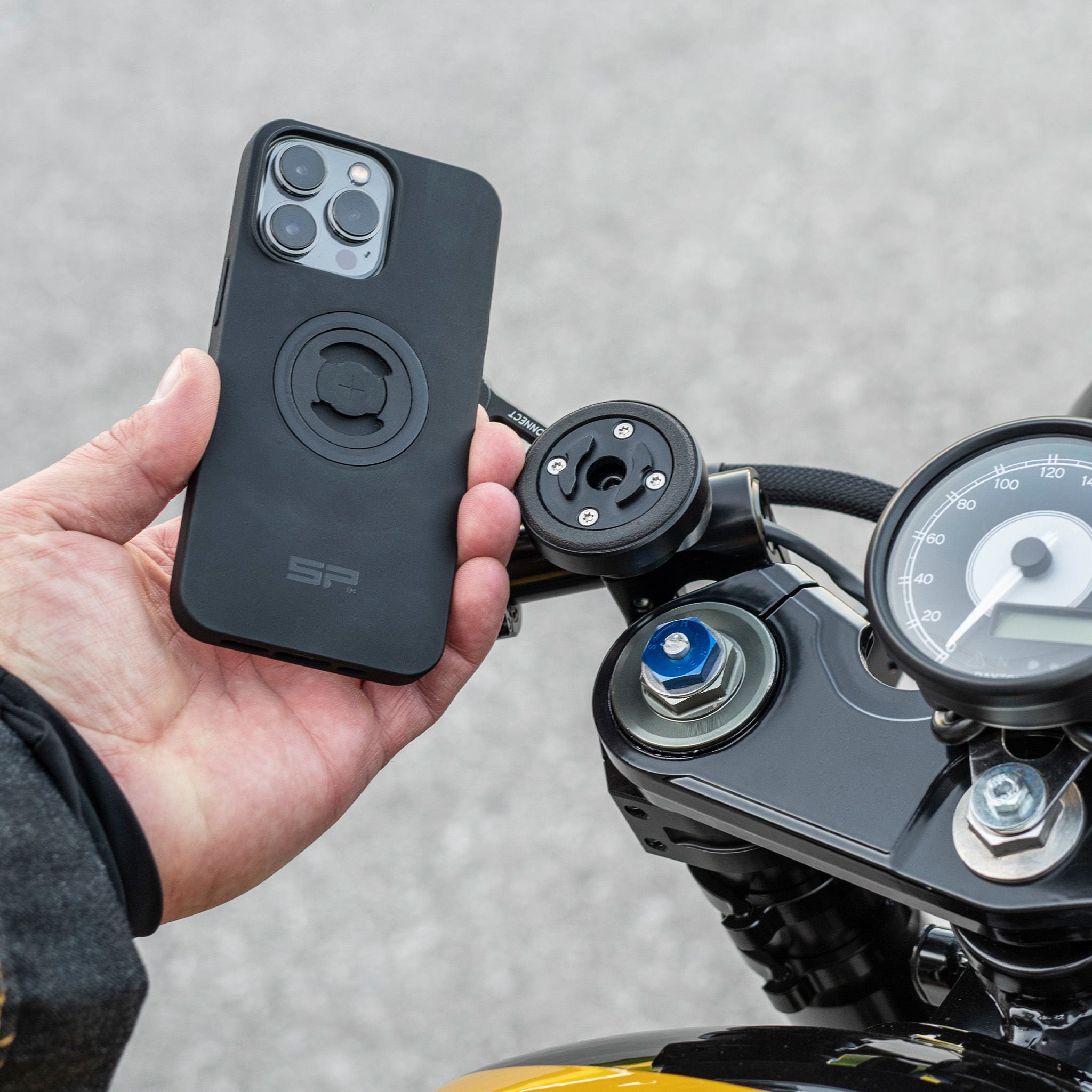 A phone ready to be mounted on a motorcycle handlebar