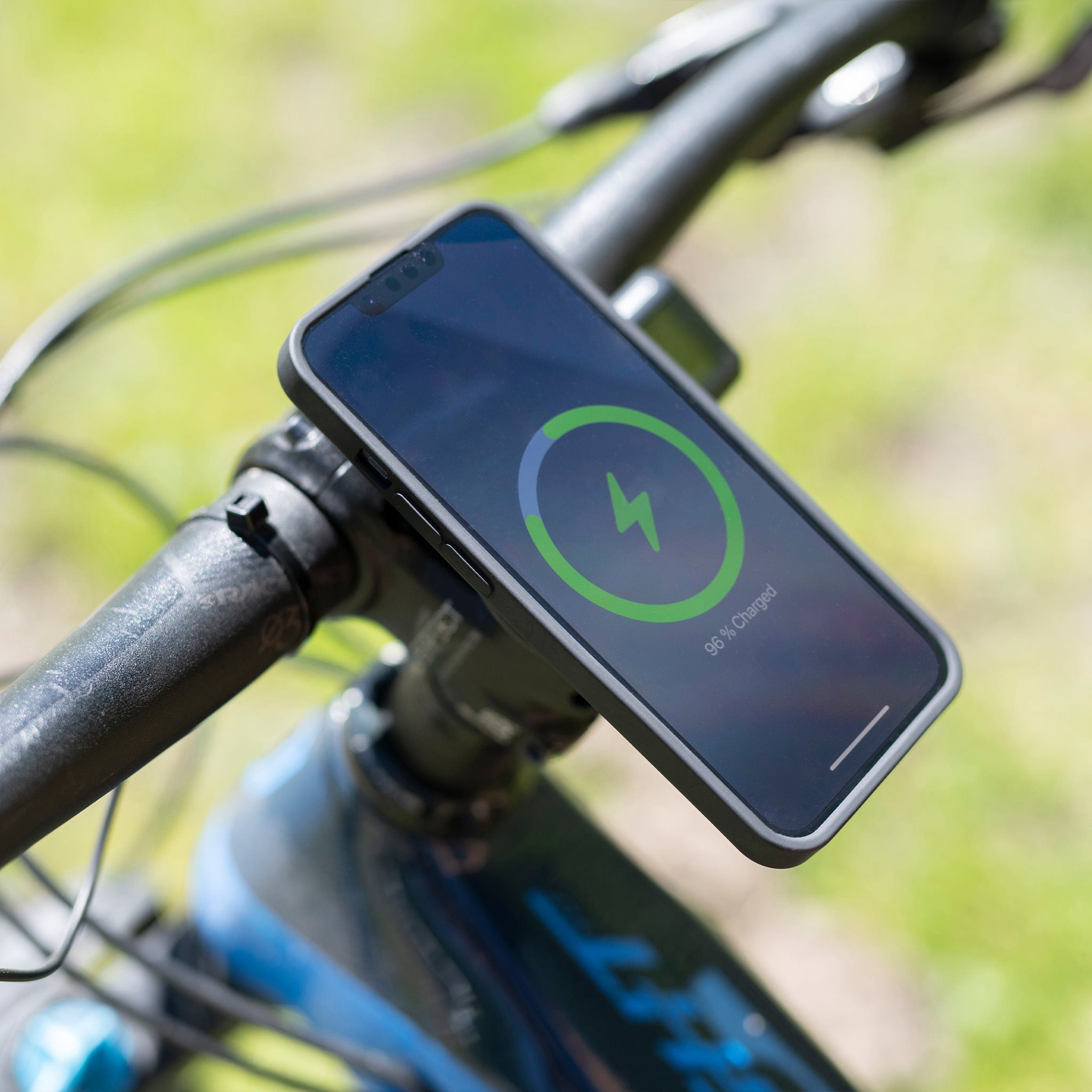 A phone mounted with the SPC holder on a motorcycle 