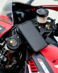 A phone mounted on the red motorcycle 